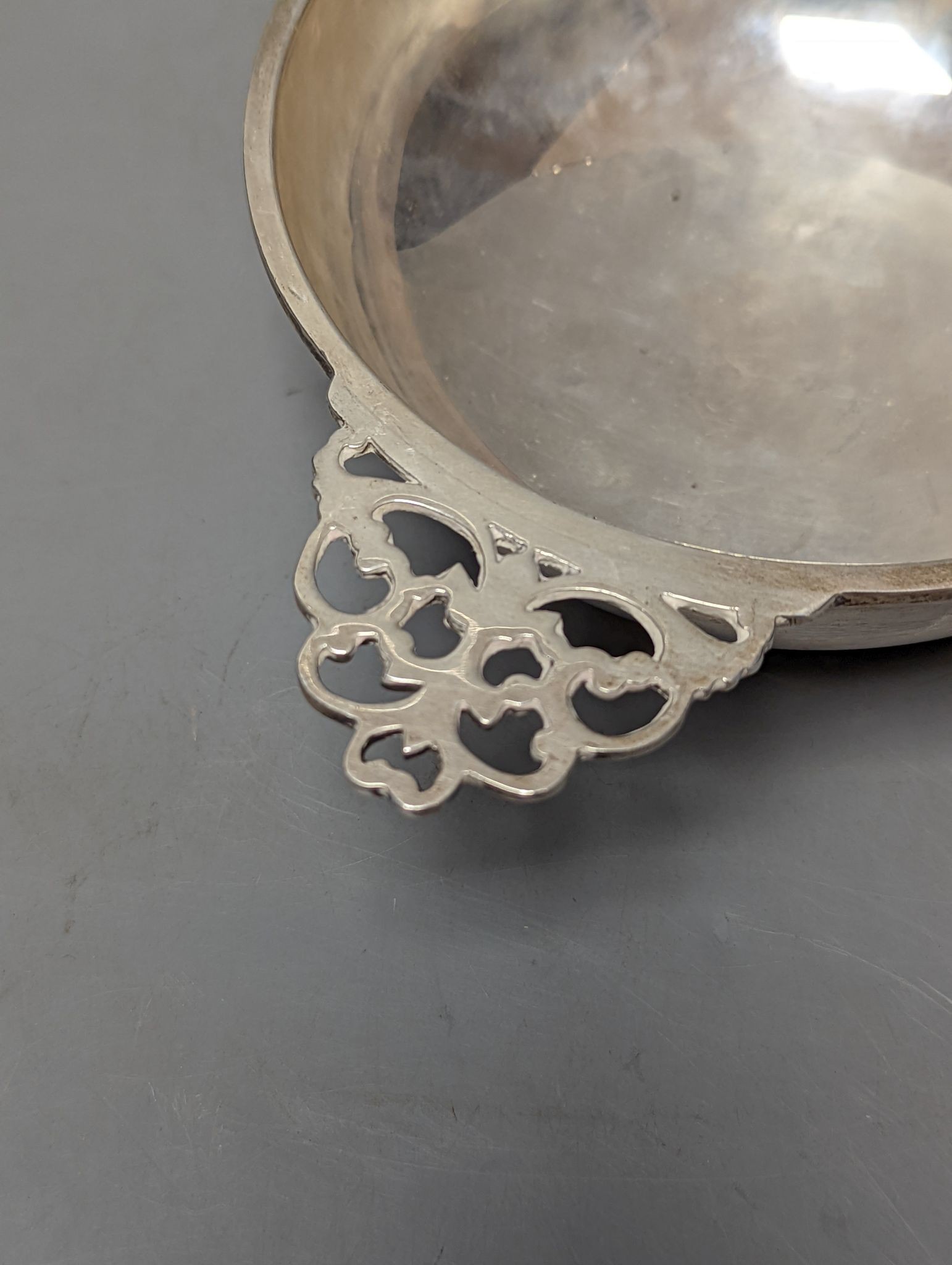 A George VI Scottish silver silver quaich, with pierced handles and engraved inscription, by H.D. Falconer & Son, Glasgow 1947, 20.2cmm over handles,7.5oz.